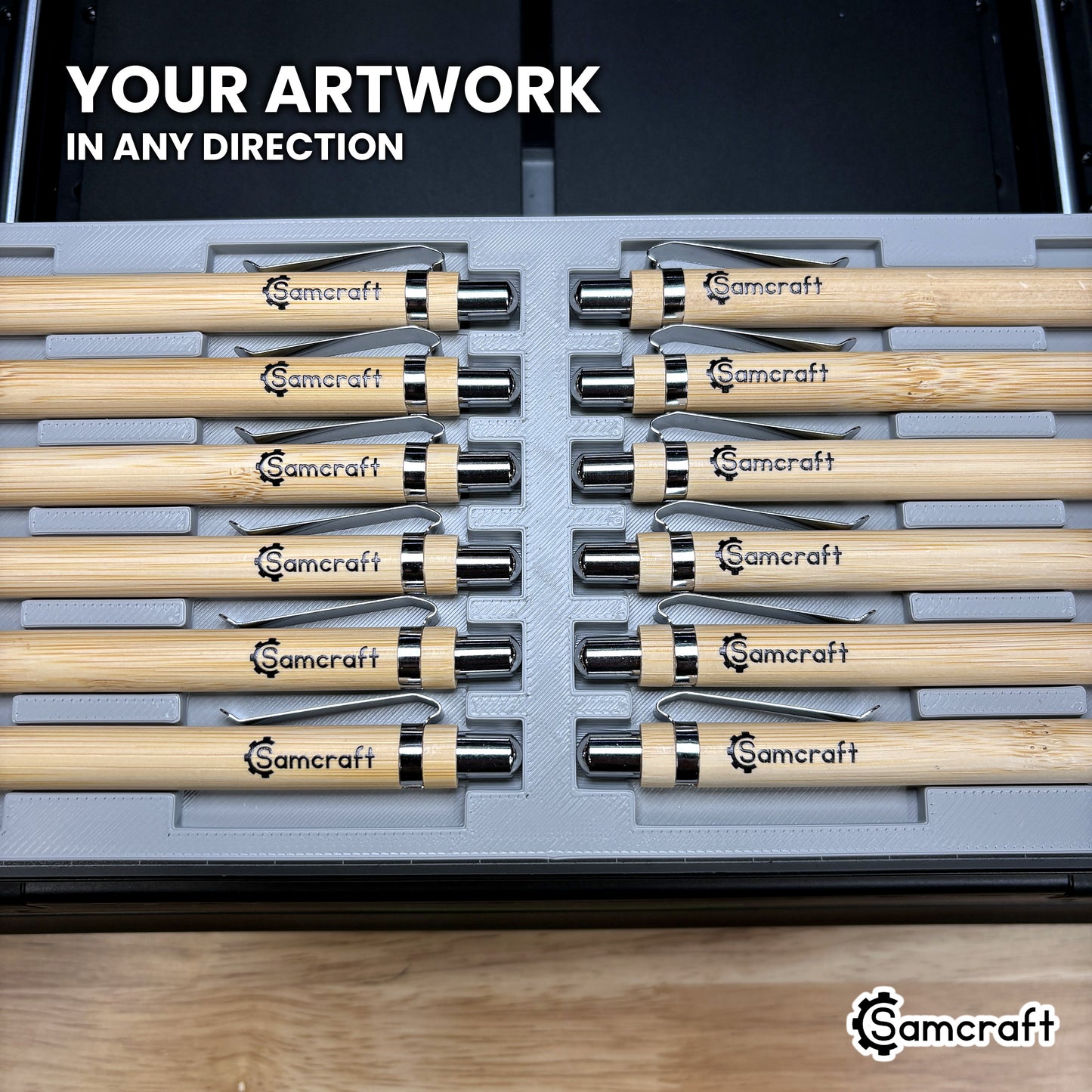 Two rows of pens loaded facing opposite directions in the Samcraft xTool Omni pen jig, artwork landing correctly either way.