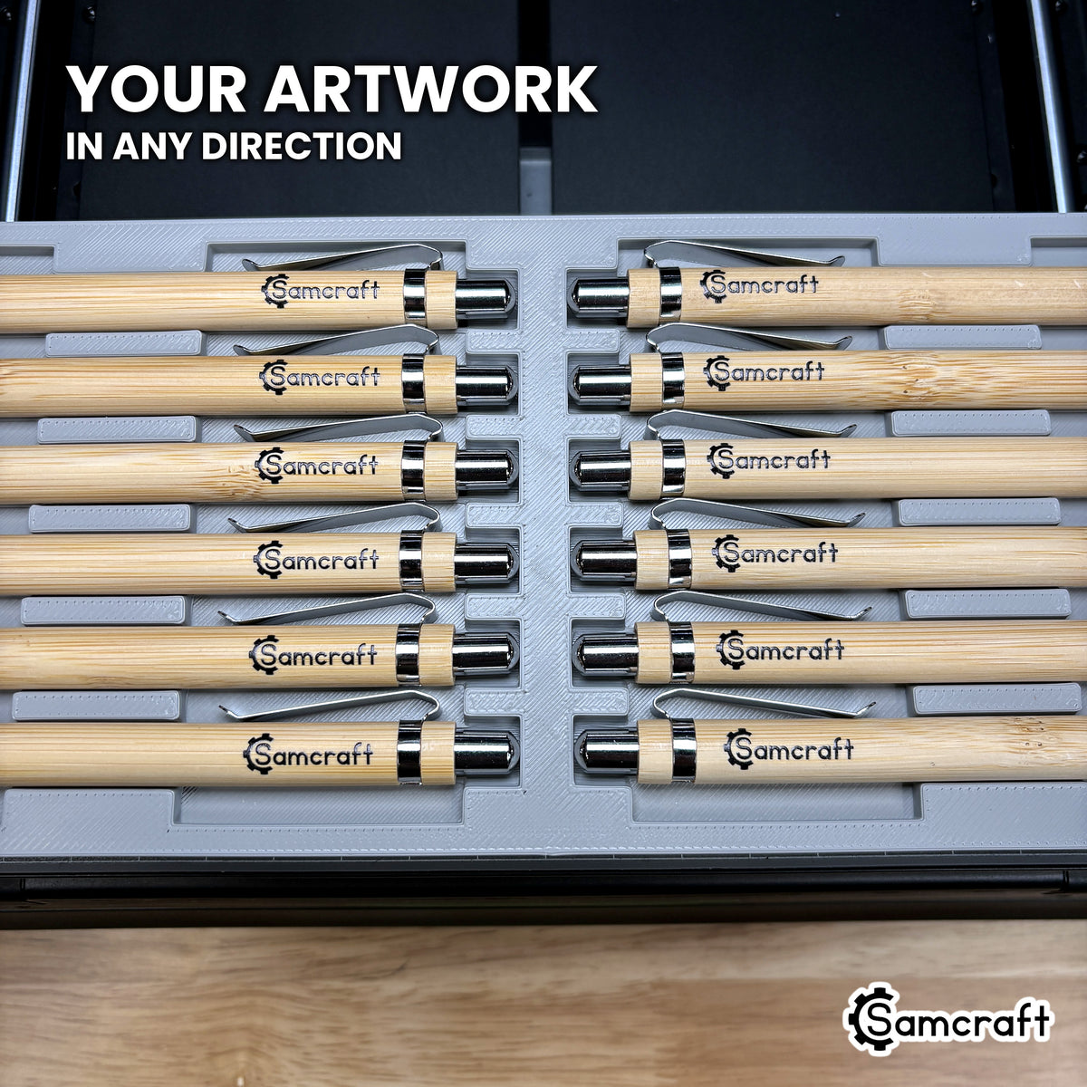 Two rows of pens loaded facing opposite directions in the Samcraft xTool Omni pen jig, artwork landing correctly either way.