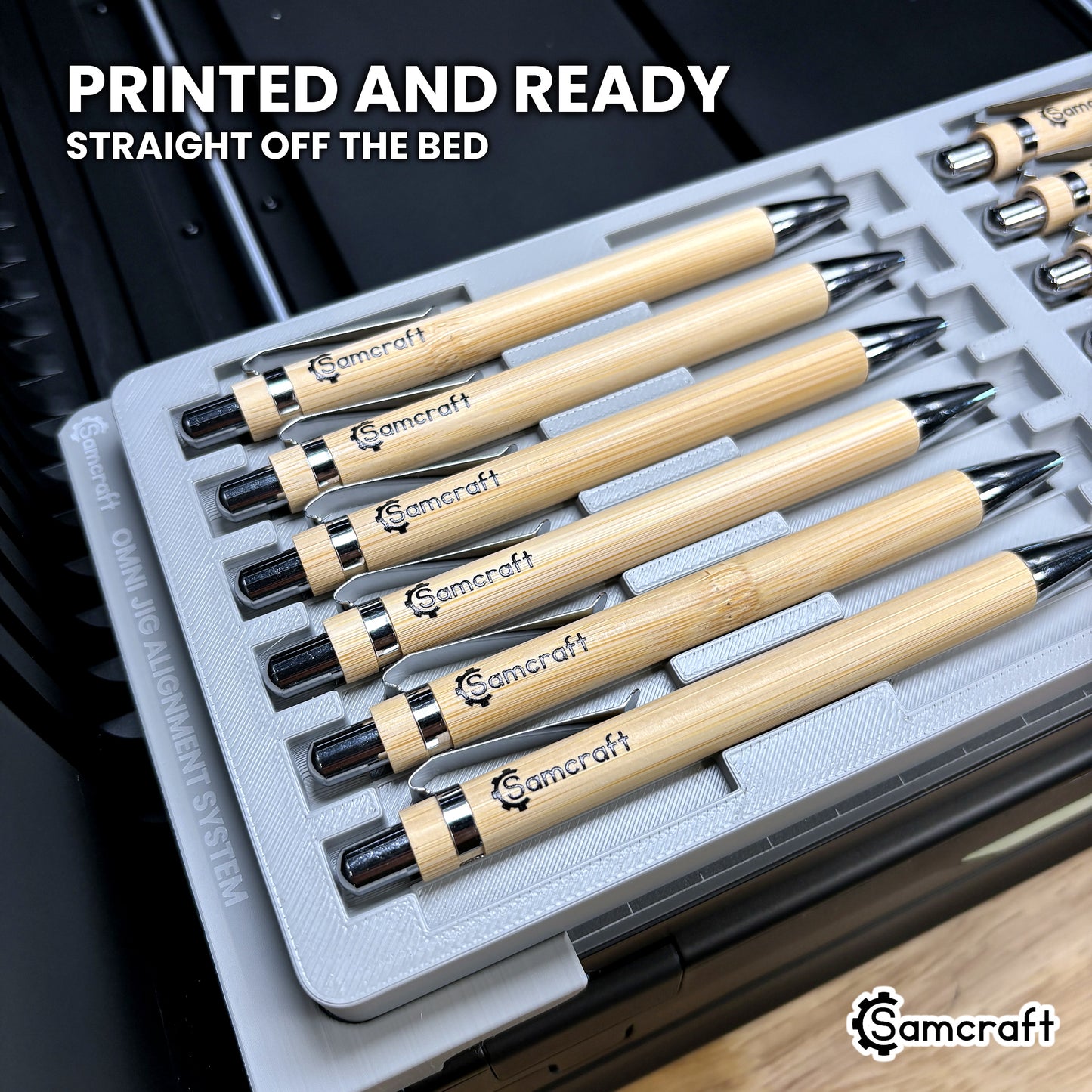 Printed bamboo pens resting in the Samcraft xTool Omni pen jig, finished and ready straight off the printer bed.