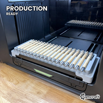 Samcraft 18 pen jig loaded with bamboo pens on the xTool Omni UV printer bed, set up for production runs.