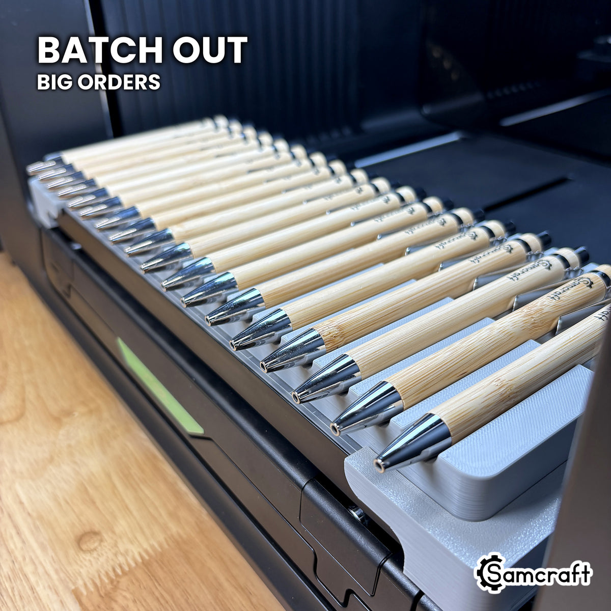 Samcraft xTool Omni pen jig filled with eighteen bamboo pens, ready for corporate gift and promotional pen batch orders.