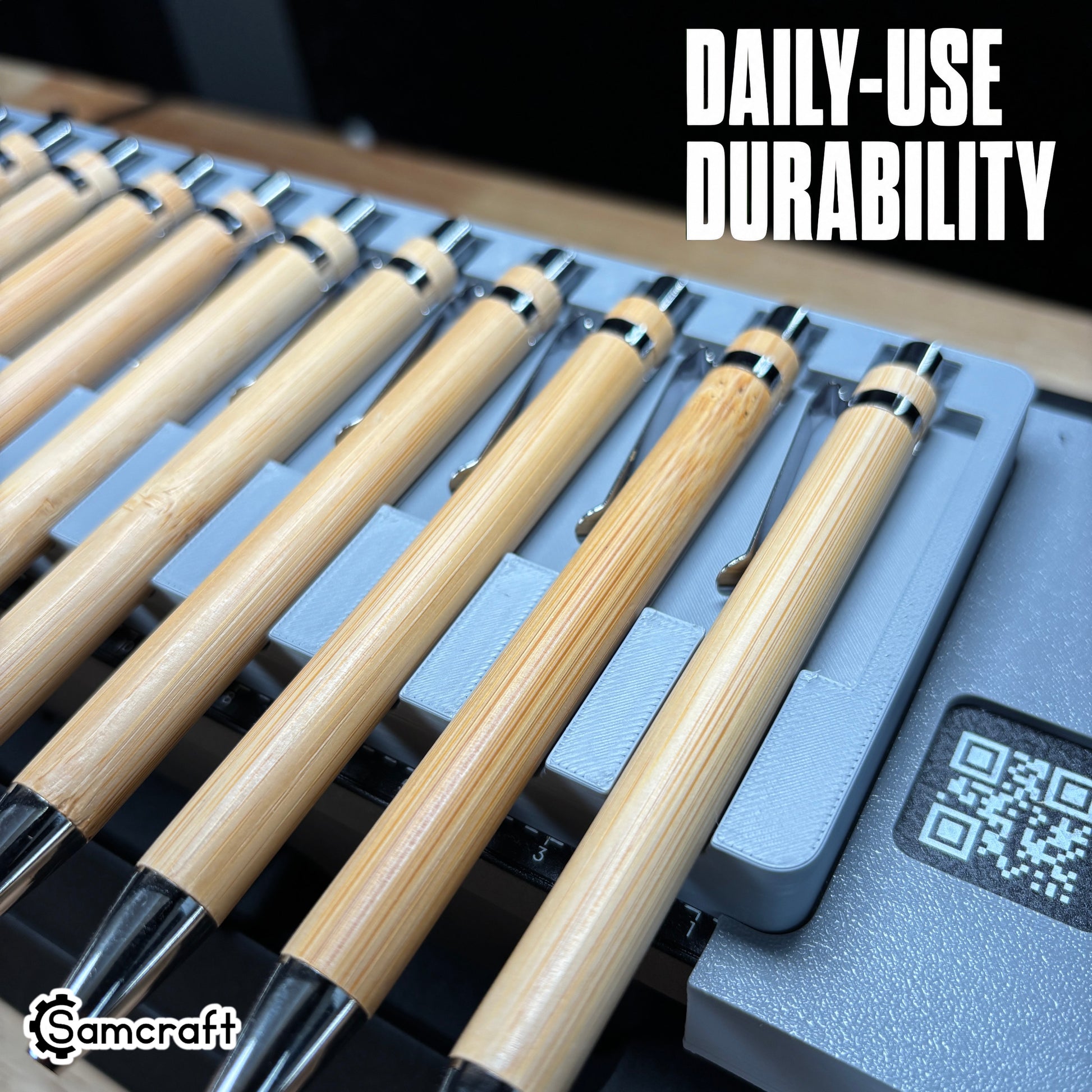 Daily-use durable Samcraft Universal Pen Jig holding bamboo pens with chrome accents in recessed channels with built-in ruler on the eufyMake E1.