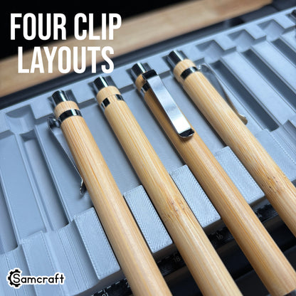 Detail of four bamboo pens showing different chrome clip orientations in the Samcraft Universal Pen Jig's recess relief cutouts on the eufyMake E1.