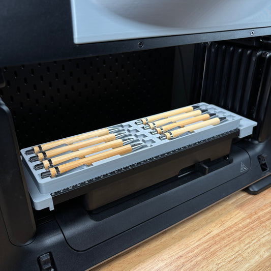 Samcraft 8 piece universal pen jig on the eufyMake E1 print bed, holding bamboo pens in wide channels.