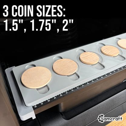 Wood Coin Jig for the eufyMake E1 — gray 3D-printed tray on the printer bed holding round wooden coins in three sizes: 1.5 inch, 1.75 inch, and 2 inch, with built-in alignment ruler.