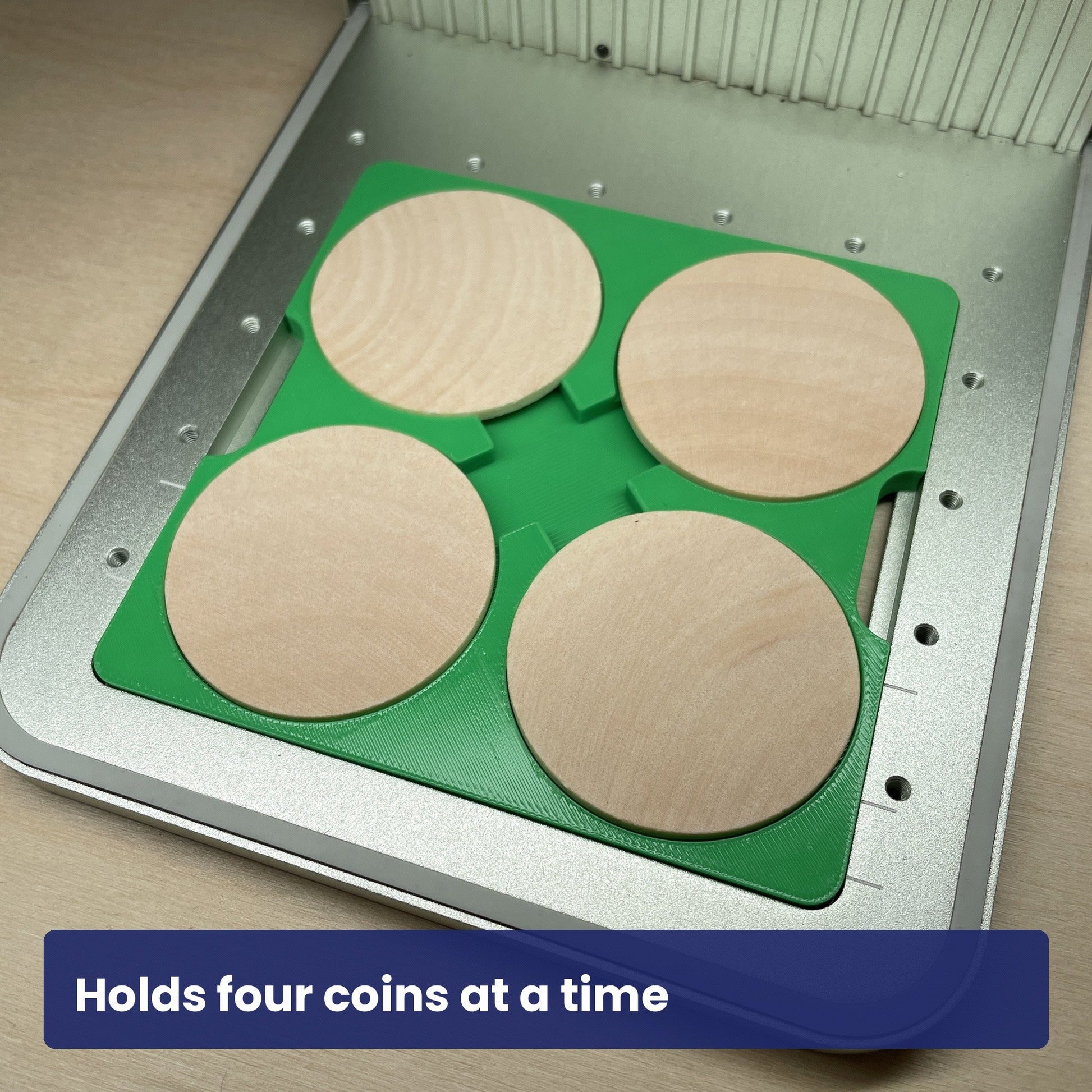 Wood coin jig loaded with four wooden coins, showing the four recesses in use.