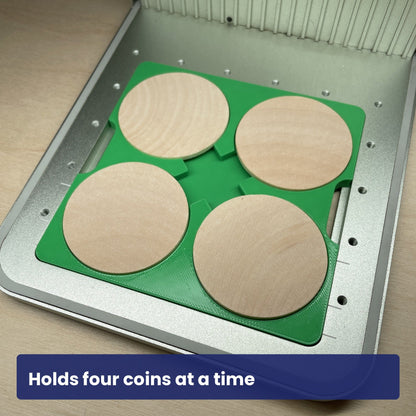 Wood coin jig loaded with four wooden coins, showing the four recesses in use.
