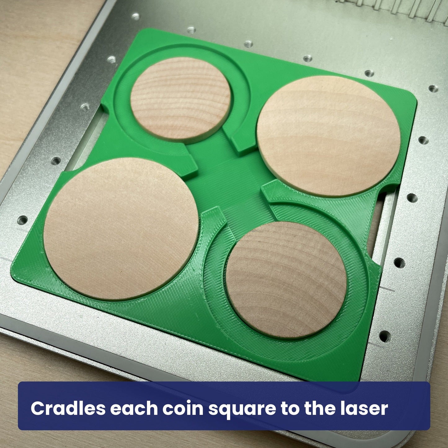 Close view of the Samcraft wood coin jig holding wooden coins in the laser bed.