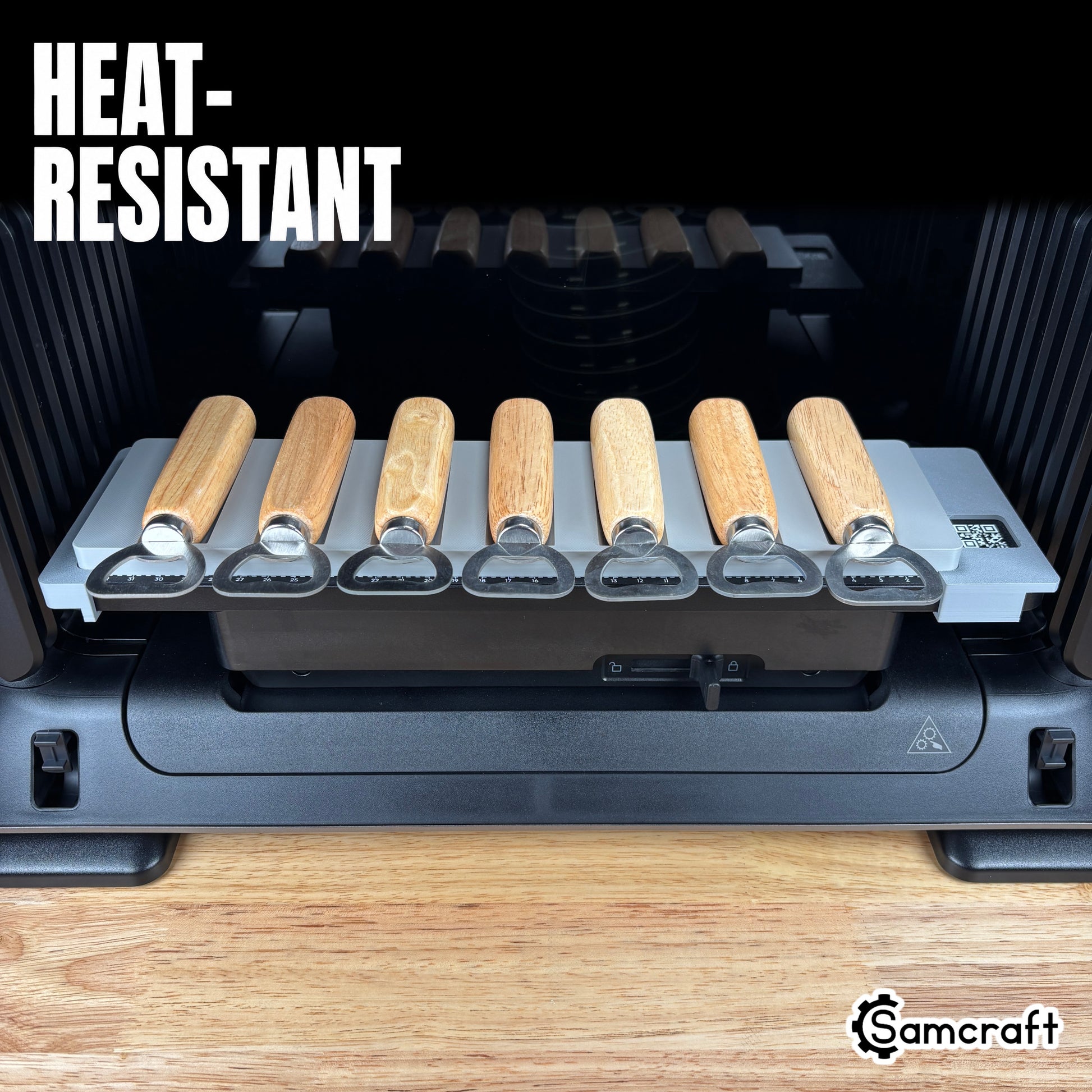 Wood Handle Bottle Opener Jig for the eufyMake E1 — front view of the gray 3D-printed tray holding seven wood-handle bottle openers on the printer bed with built-in alignment ruler, highlighting the heat-resistant material.
