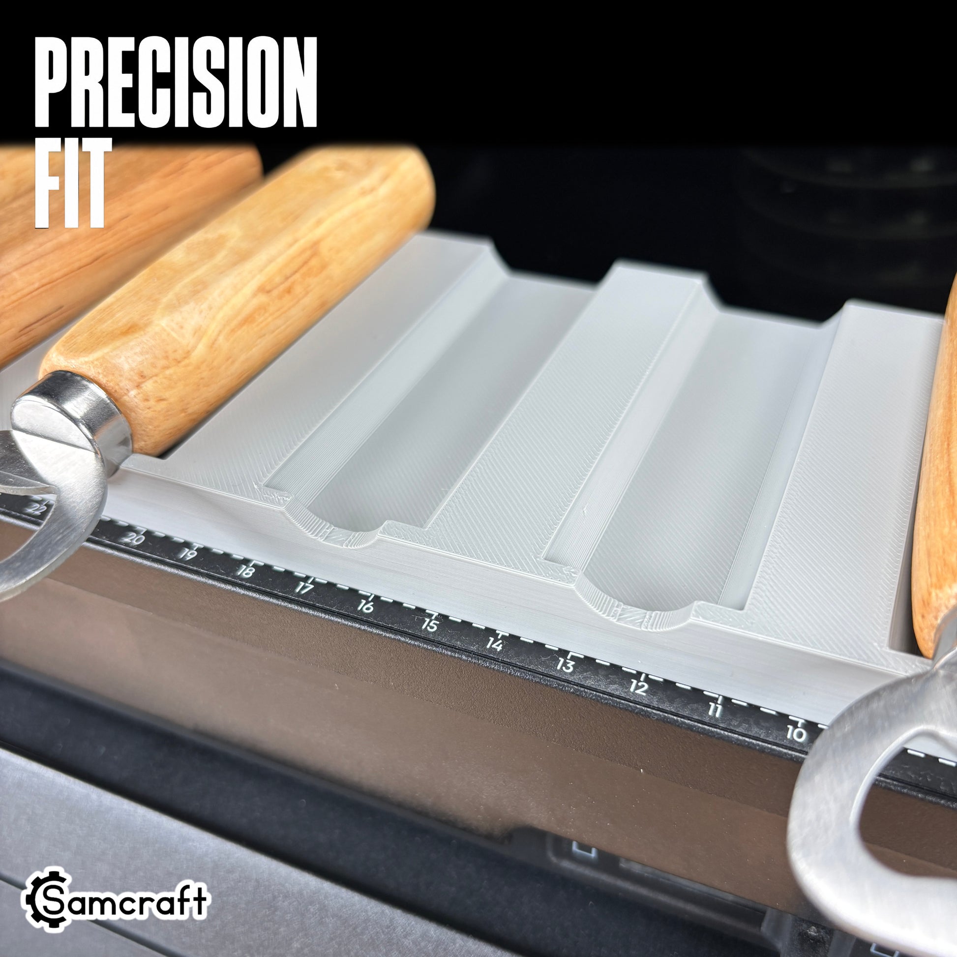 Wood Handle Bottle Opener Jig for the eufyMake E1 — close-up of the channeled slots in the gray 3D-printed tray cradling wood-handle bottle openers with built-in alignment ruler, highlighting the precision fit.