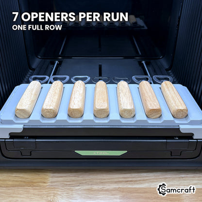 Samcraft wood handle opener jig for the xTool Omni loaded with seven bottle openers, a full row in one pass.